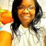 African American women taking a selfie in an office setting