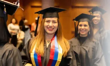 Herzing Alabama Online BSN Student Smiling at Graduation Ceremony