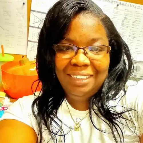 African American women taking a selfie in an office setting