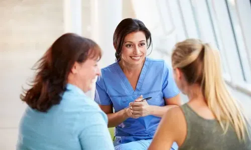 Registered Nurse with MSN Smiling with Happy Patients