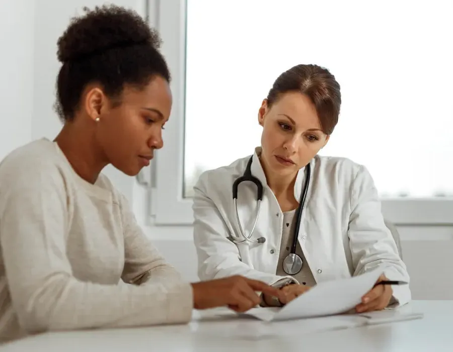 MSN DNP Nurse Practitioner Consulting Diagnosis with Patient